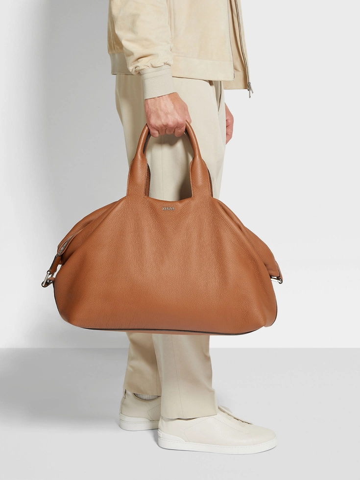 Borsa da viaggio in pelle di daino con motivo a fogliame, raglan