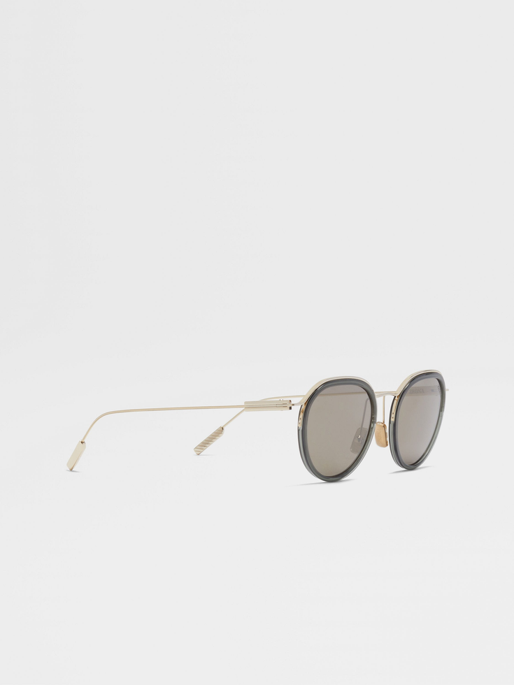 Occhiali da sole in acetato e metallo verde trasparente e oro pallido Occhiali da sole in acetato e metallo verde trasparente e oro pallido