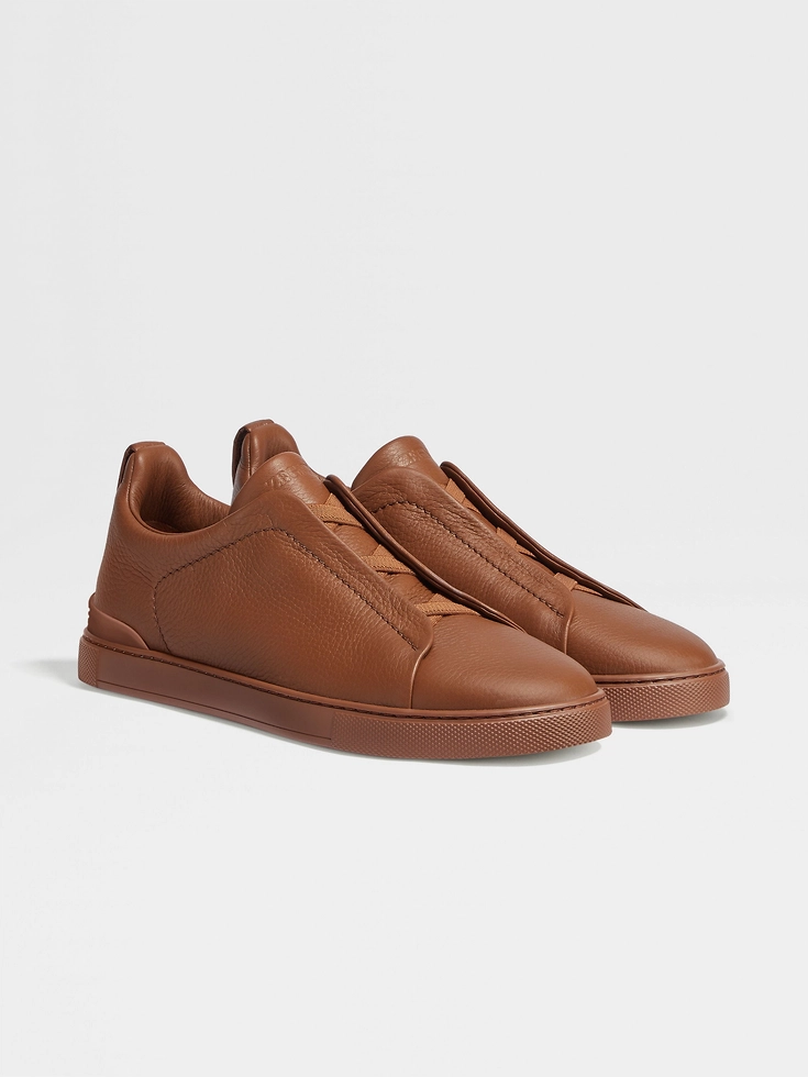 Sneakers Triple Stitch™ in pelle di daino con fogliame scuro